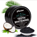 A black round tub of Vaclav teeth whitening powder with a black label, shown on a white background with coconut halves, green leaves, and a small white dish of the dark powder.
