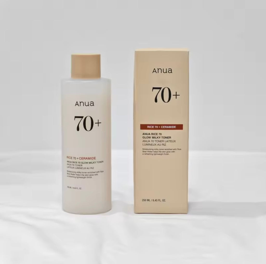 Anua 70+ Rice + Ceramide face toner bottle next to its beige packaging box, set against a neutral light gray background.