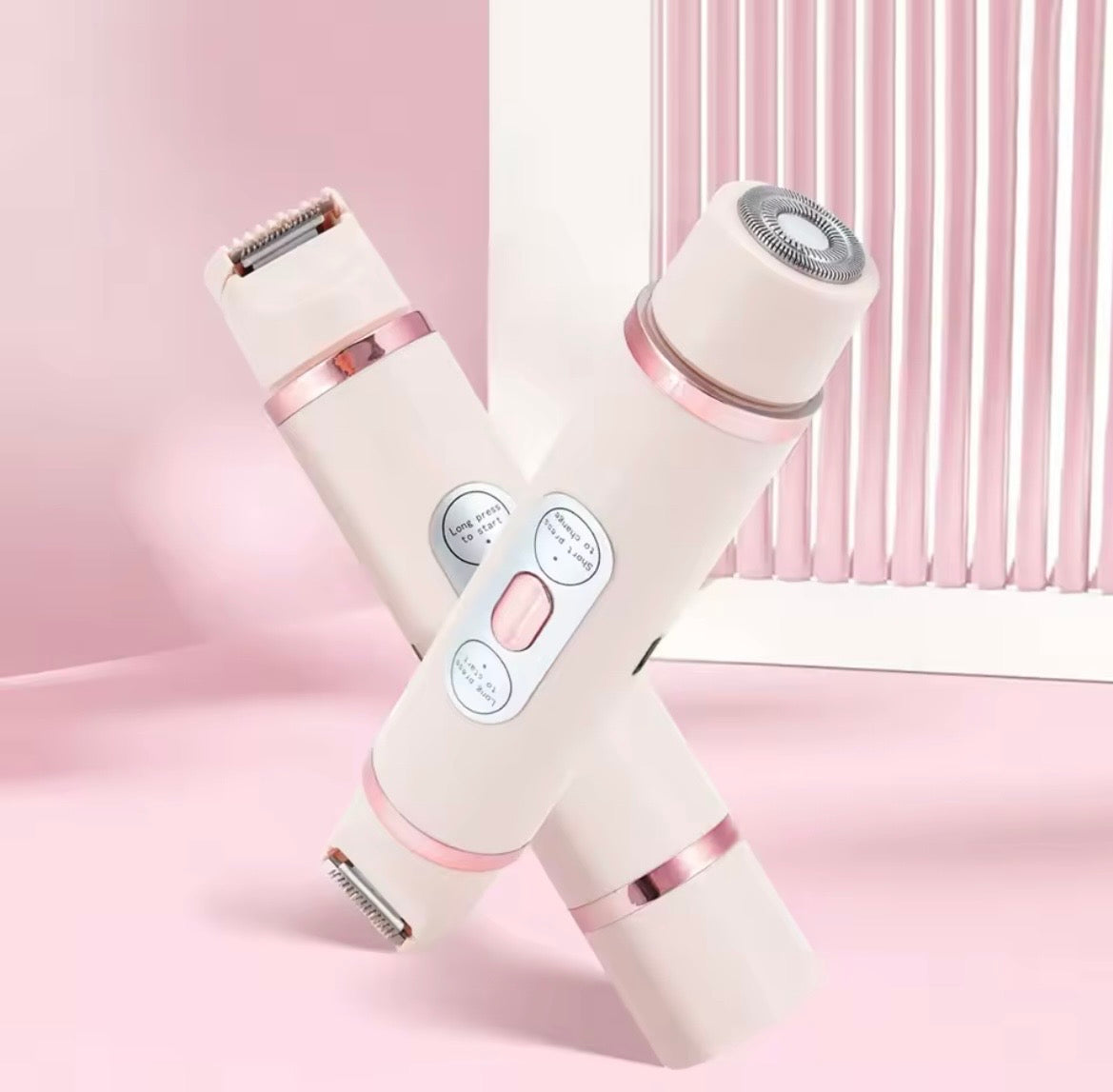 Two handheld electric shaver devices crossed in an X shape, shown against a soft pink background with a white slatted panel behind them.