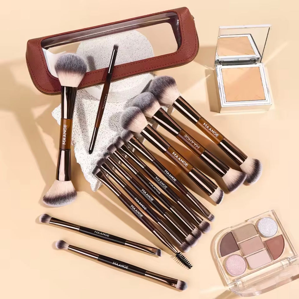 13-piece professional makeup brush set laid flat with brown storage bag, eyeshadow palette, and compact powder on beige background