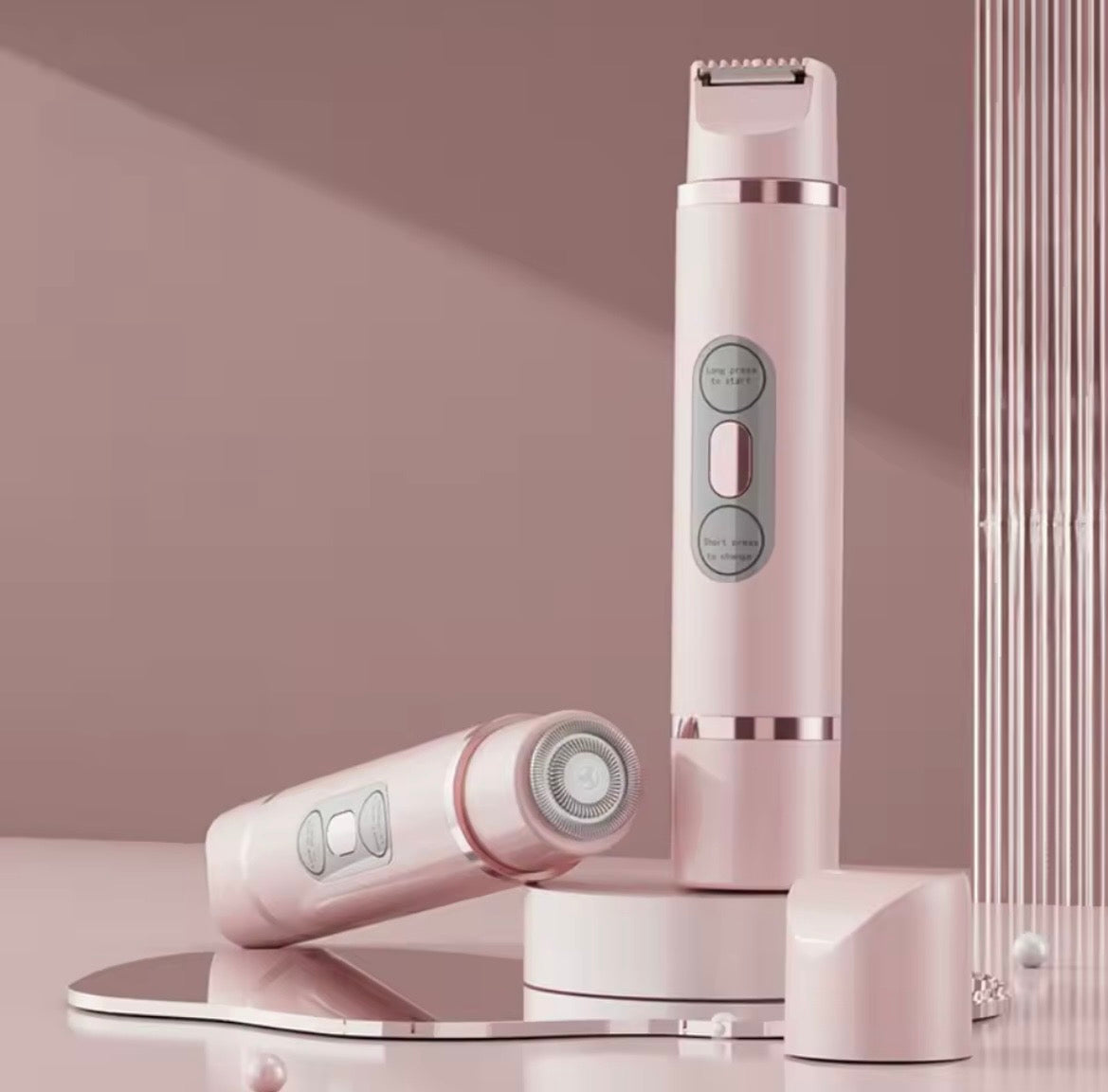 Pink and white grooming device on a reflective surface with a soft pink background
