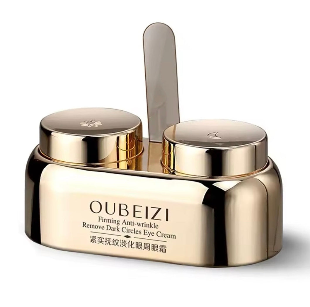 Gold eye cream jar with applicator on a white background, featuring the brand 'OUBEIZI'.